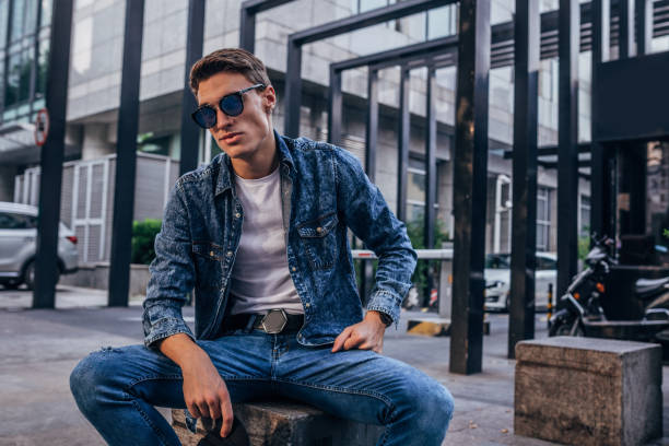 istock Modern young guy sitting outdoors 1188691806