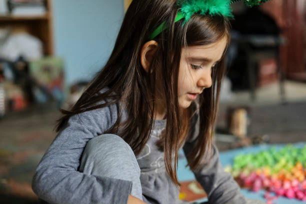 istock A little girl alone having fun in a painter's studio 1188692683