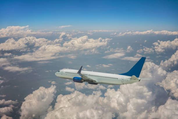 istock Passenger jet airplane flying above clouds 1188692747