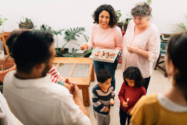 Mexican Family doing Las Posadas. Nativity scene Mexican Family doing Las Posadas. Re-enactment of a Christian scene of the Bible, Mary and Joseph looking for shelter. traditional song stock pictures, royalty-free photos & images