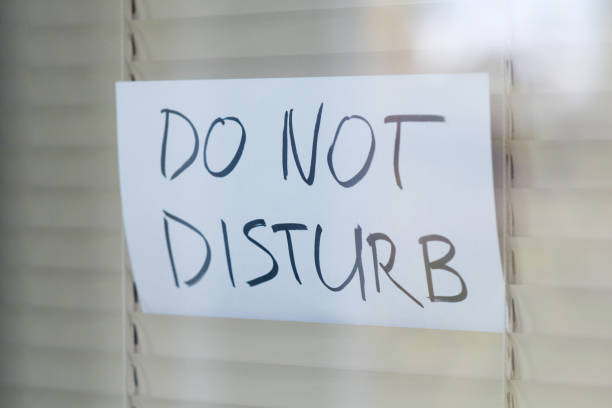 istock The request not to disturb is seen in a window closed by blinds 1188701112