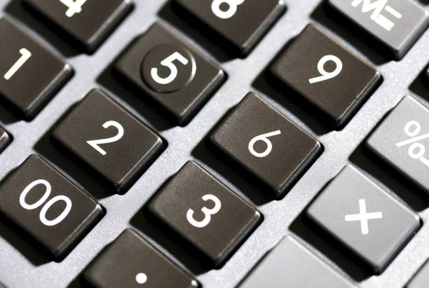 istock A Close up look at shiny numeric buttons on a hand calculator, white numbers on black calculator buttons 1188701372