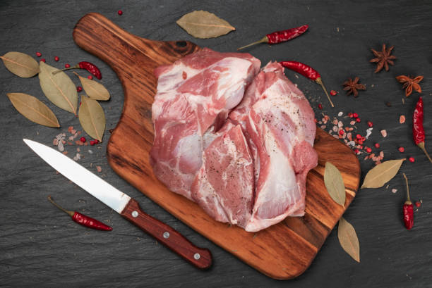 istock Fresh raw beef steak on black stone background 1188701413