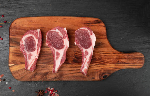 istock Raw Lamb Chops, Mutton Cuts or Sheep Ribs on Black 1188701414