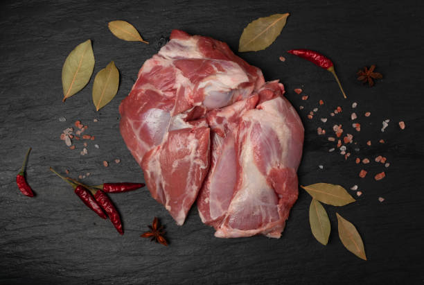 istock Fresh raw beef steak on black stone background 1188701425