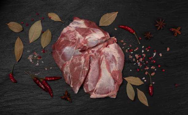istock Fresh raw beef steak on black stone background 1188701434