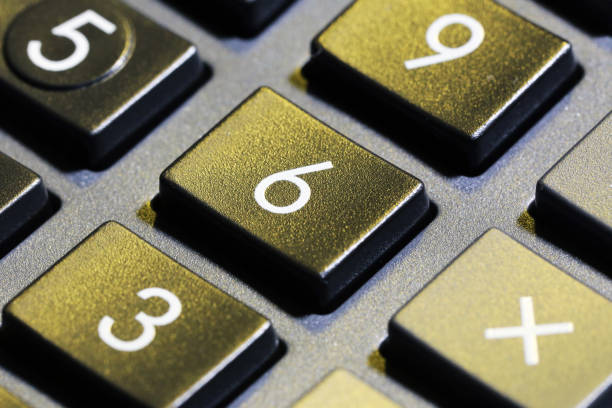 istock A Close up look at shiny numeric buttons on a hand calculator, white numbers on black calculator buttons 1188701629