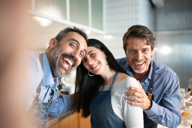 istock Colleagues taking a selfie while working in a cafeteria 1188701750