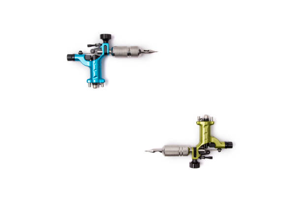 istock Blue and green tattoo machines isolated on white background 1188702714
