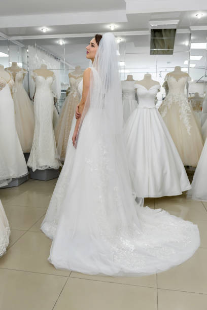 istock Attractive young bride in wedding dress in modern salon 1188703346