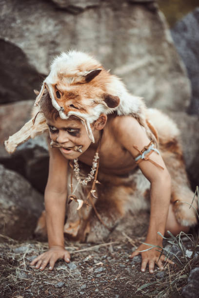 istock Caveman, manly boy hunting outdoors. Ancient warrior portrait 1188704189