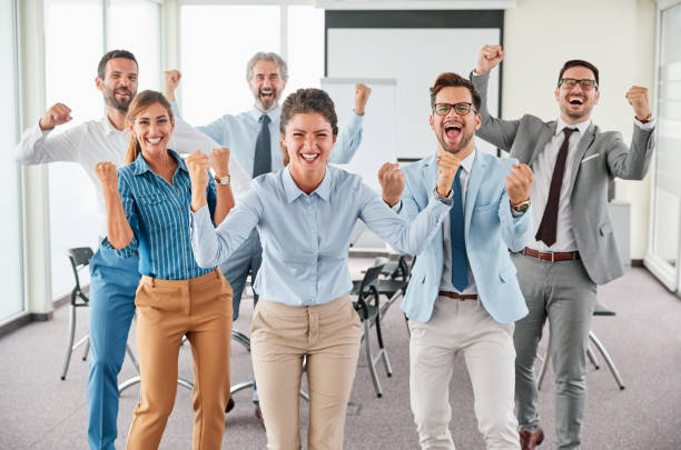 istock business people team celebrating success corporate 1188704335