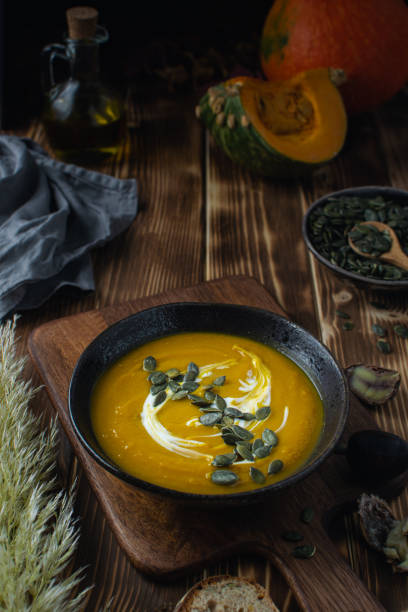istock Pumpkin squash soup with seeds, olive oil 1188704868