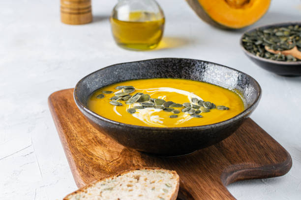 istock Pumpkin squash soup with seeds, olive oil 1188705931