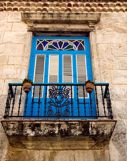Blue colonial house with an ornate white wooden door in the old center of Trinidad, Cuba, Caribbean