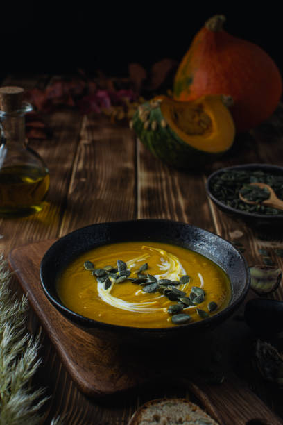 istock Pumpkin squash soup with seeds, olive oil 1188707379