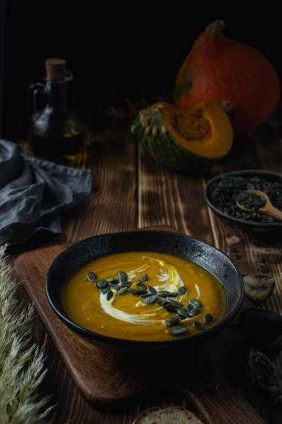 istock Pumpkin squash soup with seeds, olive oil 1188707597