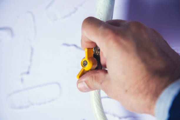 istock man hand in gas valve 1188708127