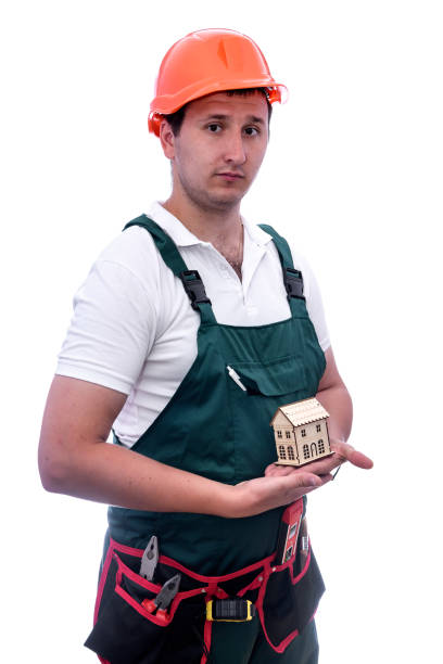 istock Worker with helmet holding wooden house model 1188710550