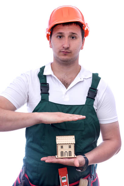 istock Man holding wooden house model on palm 1188710658
