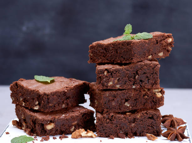 istock stack of baked square pieces of chocolate brownie pie with walnuts 1188710691