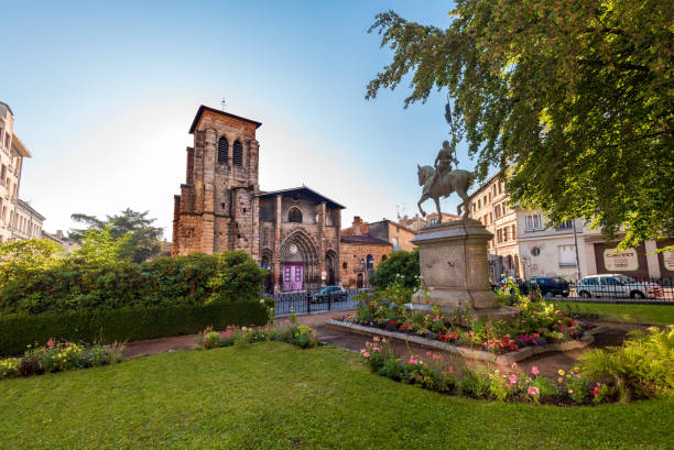 Saint Etienne Church as seen from Boivin square. Jean d"u2019Arc monument is at right foreground. Saint-Etienne, France- July 29, 2019 Saint Etienne Church as seen from Boivin square. Jean d"u2019Arc monument is at right foreground. saint étienne photos stock pictures, royalty-free photos & images