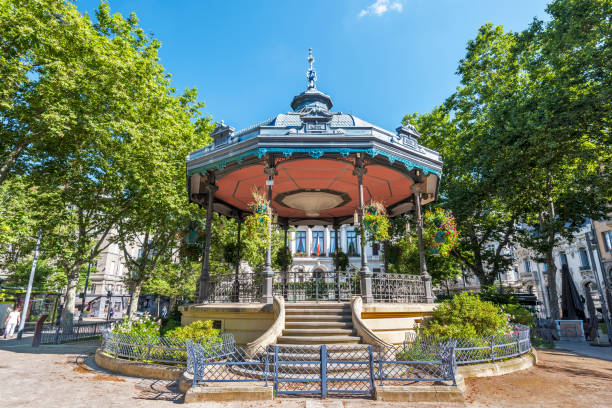 The bandstand is in the square of Jean Jaures in Saint Etienne downtown. The City Hall building is at background. Saint-Etienne, France - July 29, 2019 The bandstand is in the square of Jean Jaures in Saint Etienne downtown. The City Hall building is at background. saint étienne photos stock pictures, royalty-free photos & images