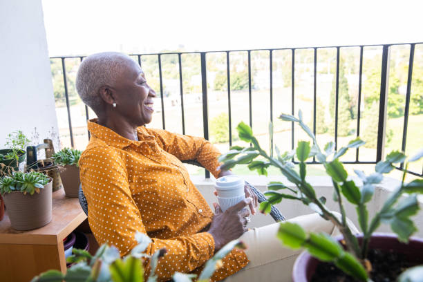 istock Woman Relaxing on Her Balcony 1188711266