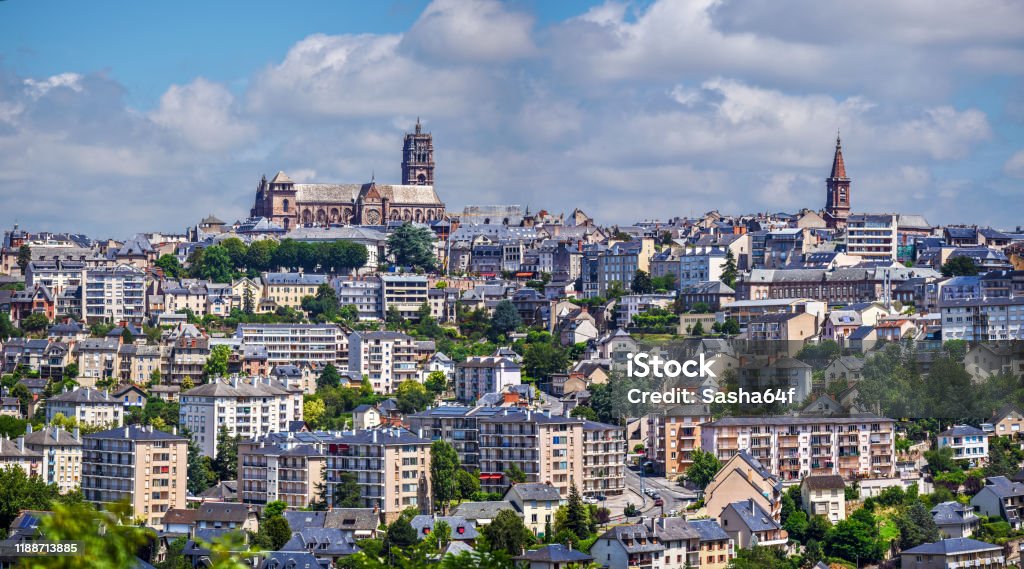 Panoramic view of Rodez city, in South of France. The Cathedral of Notre-Dame of Rodez is at left and the tower of The Church of Saint Amans is at right. Rodez Stock Photo