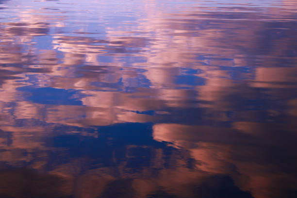istock Reflection of white clouds in a blue sky in the water. 1188714670