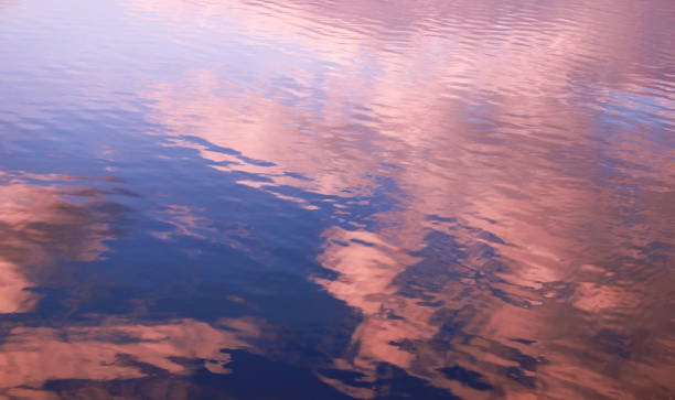 istock Reflection of white clouds in a blue sky in the water. 1188715160