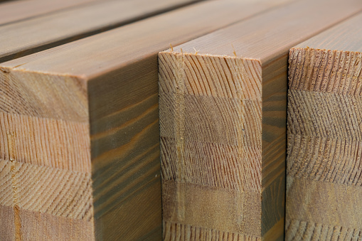 Pine wood planks prepared for installation on the construction site