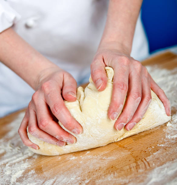 istock Cook knead the dough 1188720056