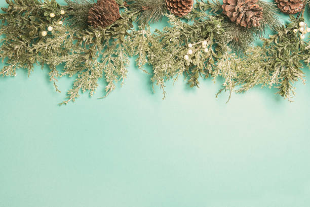 istock Christmas decotation evergreen tree branches cones Vintage background 1188724495