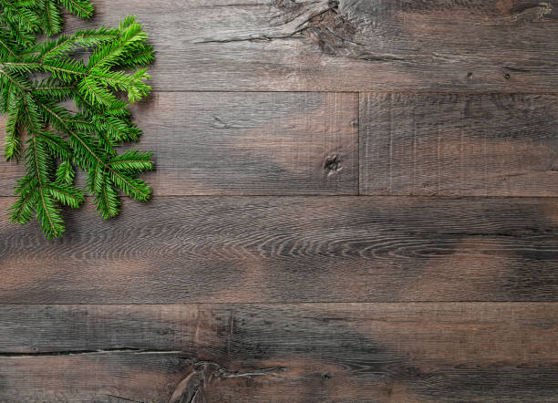 istock Christmas tree branches dark wooden background 1188724513