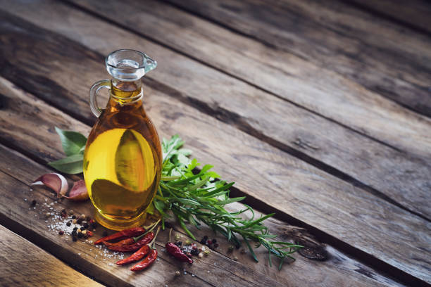 istock Food backgrounds: olive oil, herbs and spices with copy space 1188724783