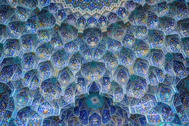 Tilework at Shah Mosque on Imam Square, Isfahan, Iran Ceiling and wall tilework at the Shah Mosque on Imam Square, Isfahan, Iran. The mosque is also known as Imam Mosque and Jaame' Abbasi Mosque. It is one of the masterpieces of Iranian/Persian Architecture and an excellent example of Islamic era architecture of Iran and also one of the top sights of the contry. isfahan stock pictures, royalty-free photos & images