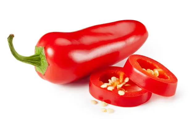 Photo of Red jalapeno peppers with sliced on white