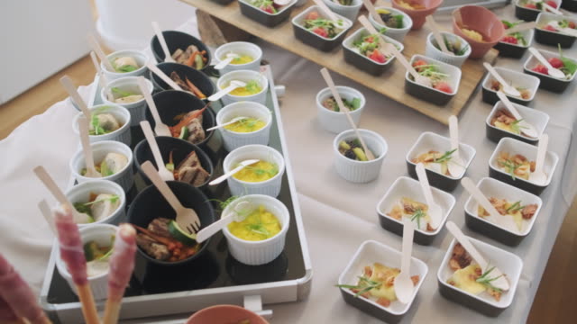 Ramekins and Small Dishes of Savory Food on Buffet Table