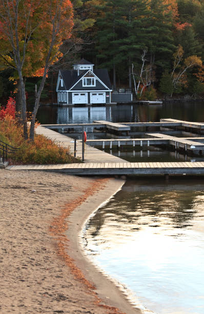 istock Beach and Boathouse on Lake in Fall 1188728845