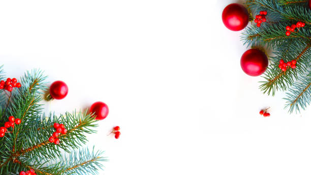 istock Natural spruce branches with red baubles on white background. Flat lay, top view, copy space. Beautiful Christmas greeting card 1188729217