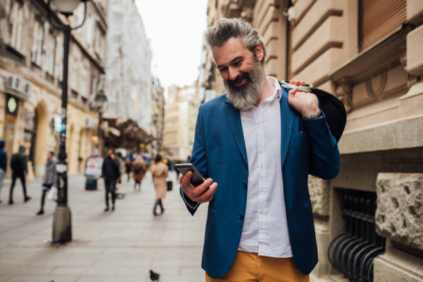 istock Mature businessman going to work and using a smartphone 1188729308