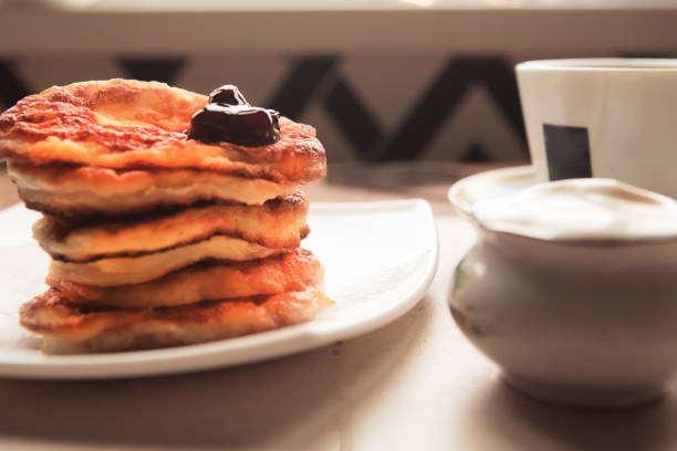 istock Sweet homemade pancakes stack and tea cup 1188730185