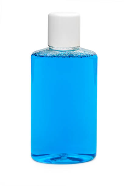 istock Bottle with mouthwash for teeth care isolated on white. 1188732700