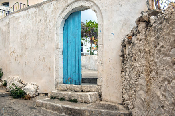 istock Opened door in old abandoned wall, Crete island, Greece 1188734139