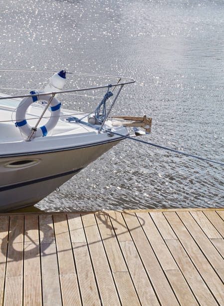 istock Boat bow moored to a pier in marina. 1188735392