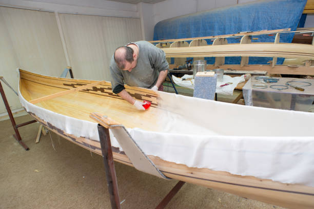 istock Carpenter making wooden canoe in his workshop 1188737762