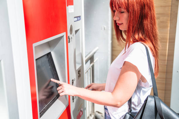 istock Young girl touches terminal screen with finger 1188738618