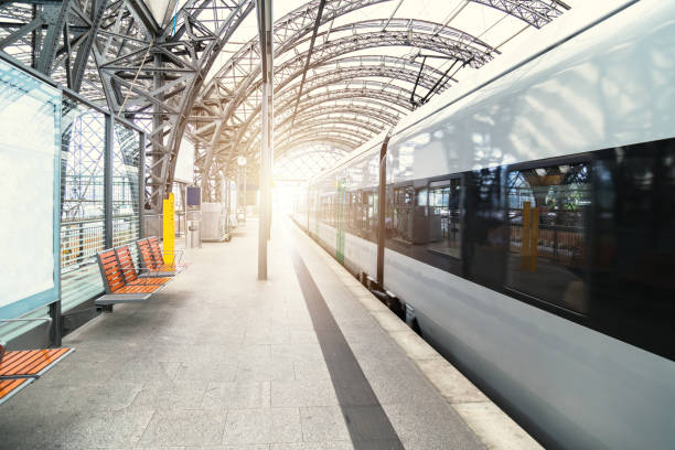 istock Modern train at empty platform of railway station 1188739268