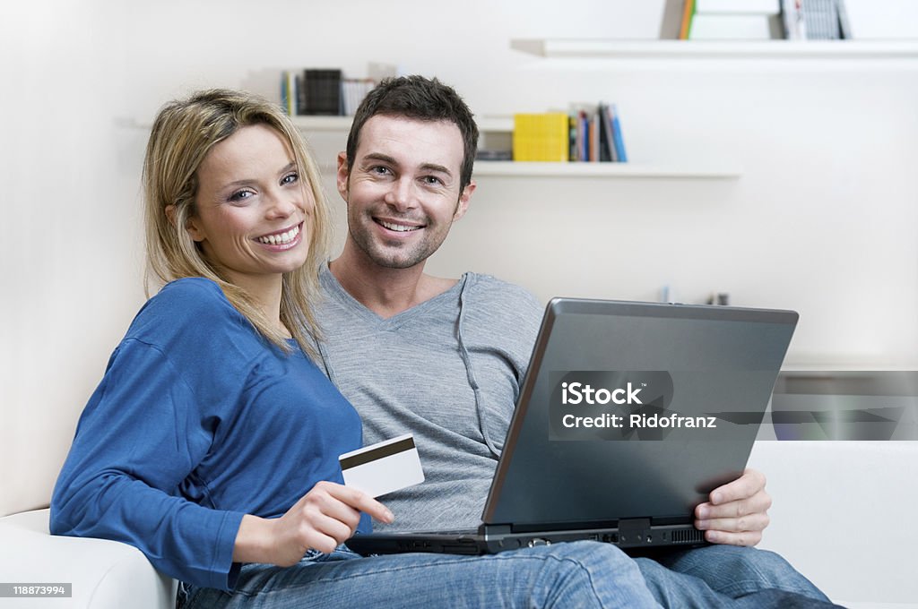 Smiling couple making shopping online  20-29 Years Stock Photo